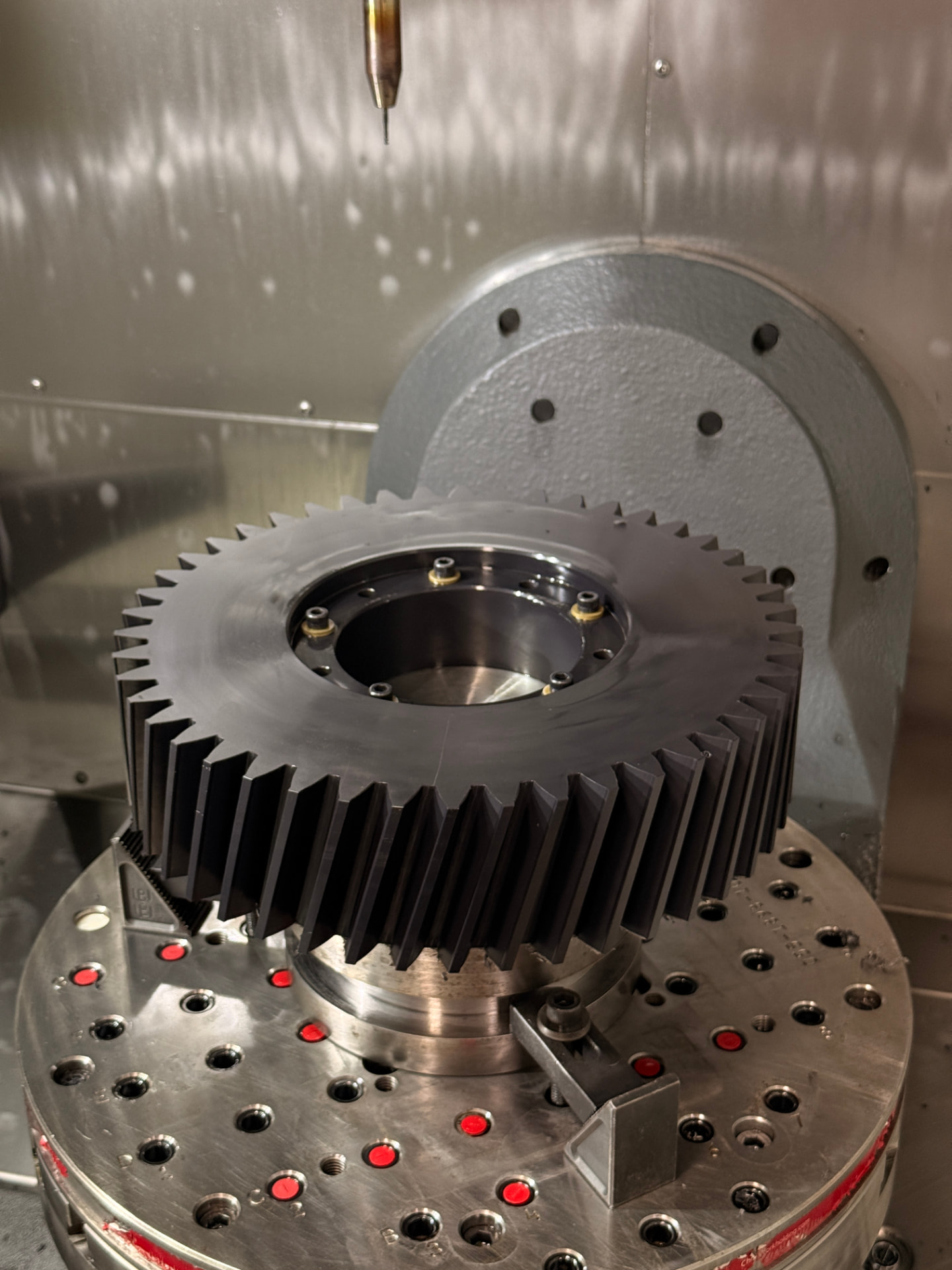 Finished nylon gear mounted in a CNC machining center